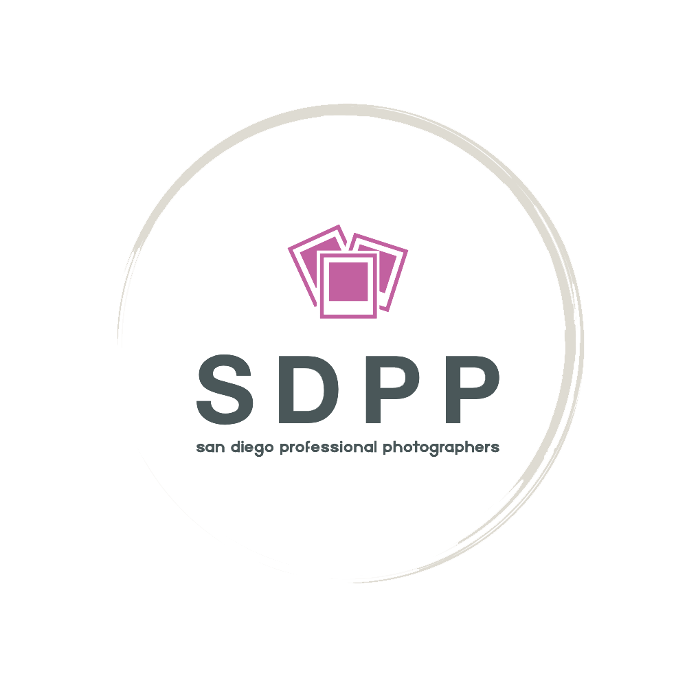 logo of san diego professional wedding photographers. grey half-circle, surrounding in bold-cap-type: SDPP